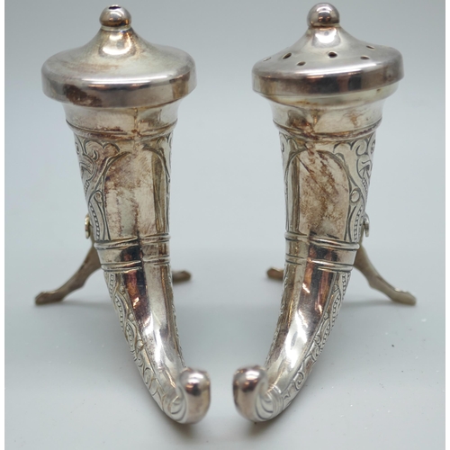 7243 - A pair of Theodor Olsen Norwegian silver salt and pepper pots in the form of Viking drinking horns, ... 