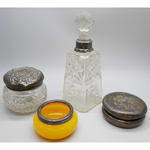 7246 - A silver topped dressing table pot and scent bottle, a silver rimmed salt and a circular silver pot ... 