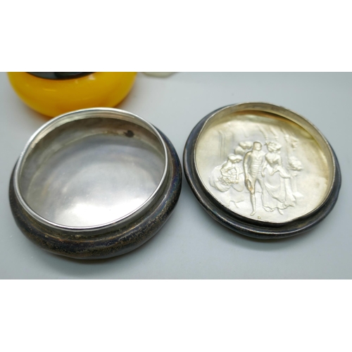 7246 - A silver topped dressing table pot and scent bottle, a silver rimmed salt and a circular silver pot ... 