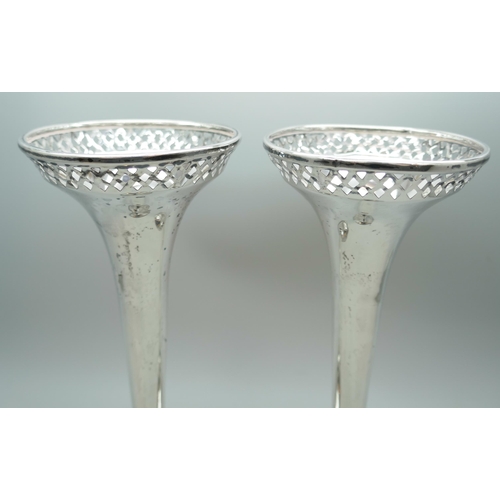 7249 - A pair of pierced silver vases, Walker & Hall, Sheffield 1911, 308g total weight (weighted bases), 1... 