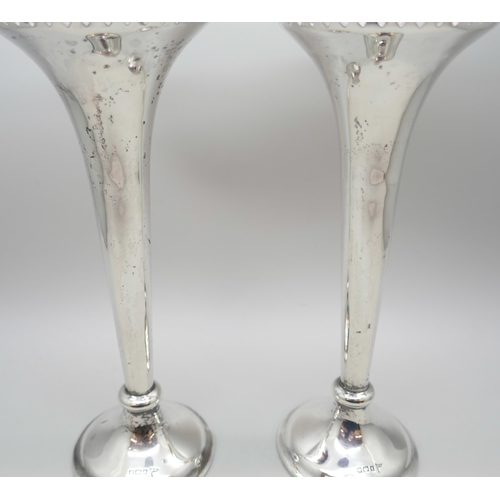 7249 - A pair of pierced silver vases, Walker & Hall, Sheffield 1911, 308g total weight (weighted bases), 1... 