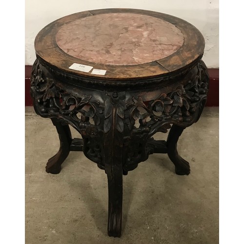 106 - A 19th Century Chinese carved padouk wood and marble topped jardiniere stand