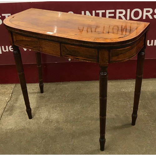 109 - A George IV rosewood and satinwood D-shaped fold over games table