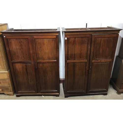 116 - A pair of Edward VII fitted mahogany two door wardrobes