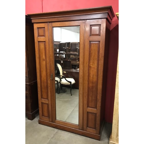 115 - A late Victorian walnut fitted two door compactum wardrobe