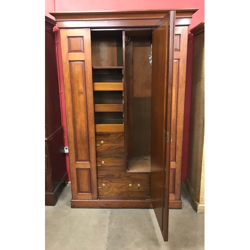 115 - A late Victorian walnut fitted two door compactum wardrobe