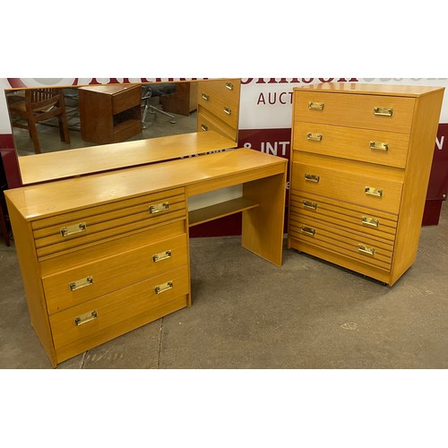 95 - A teak chest of drawers and matching dressing table