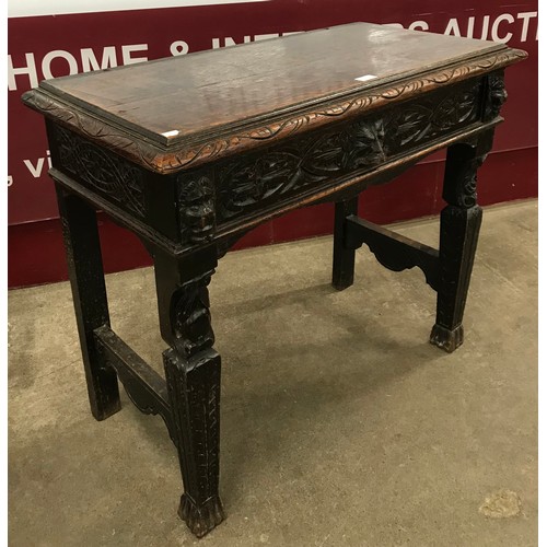 126 - A Victorian Jacobean Revival carved oak green man hall table