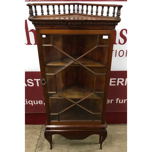 133 - A late Victorian mahogany freestanding corner cabinet