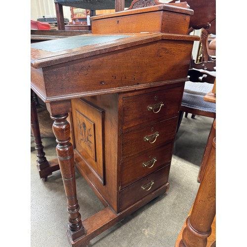 203 - A Victorian walnut Davenport