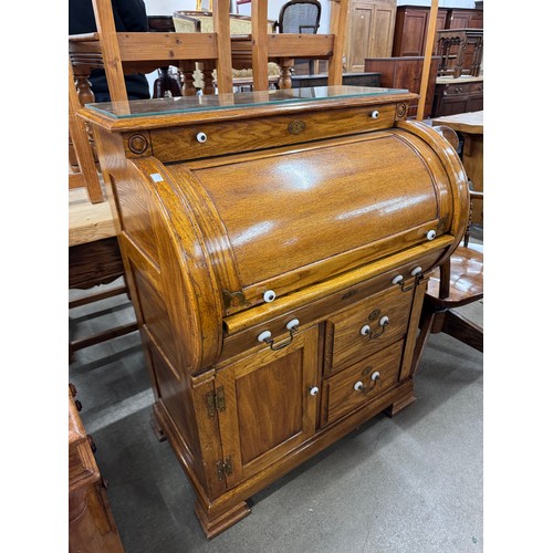 205 - An American oak cylinder top bureau