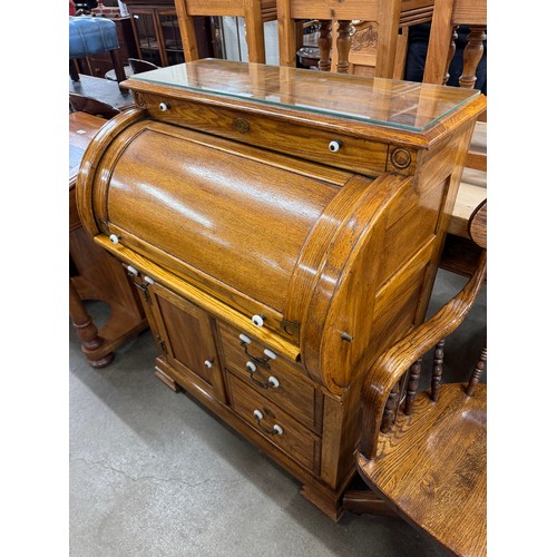 205 - An American oak cylinder top bureau