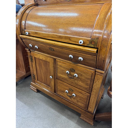 205 - An American oak cylinder top bureau