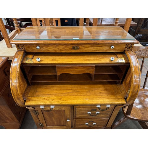 205 - An American oak cylinder top bureau