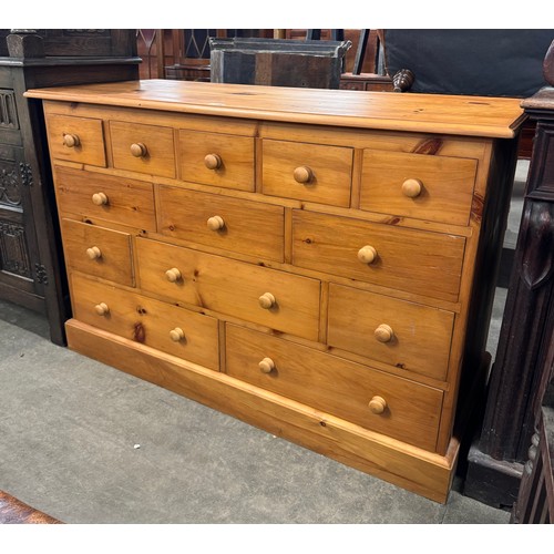 207 - A Victorian style pine thirteen drawer chest