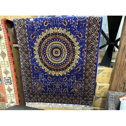 3022 - A blue ground Afghan hand woven double knot rug with central medallion design (woven from Worcester ... 