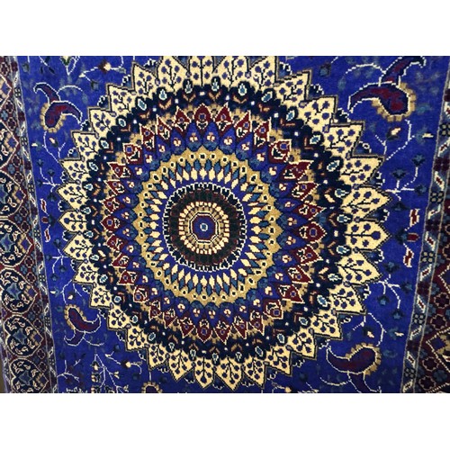 3022 - A blue ground Afghan hand woven double knot rug with central medallion design (woven from Worcester ... 