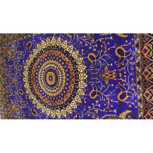 3022 - A blue ground Afghan hand woven double knot rug with central medallion design (woven from Worcester ... 