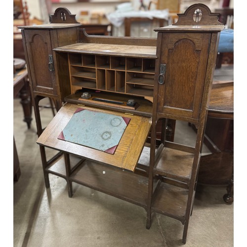 189 - An Arts and Crafts oak writing cabinet