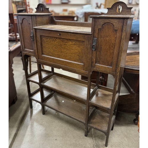 189 - An Arts and Crafts oak writing cabinet