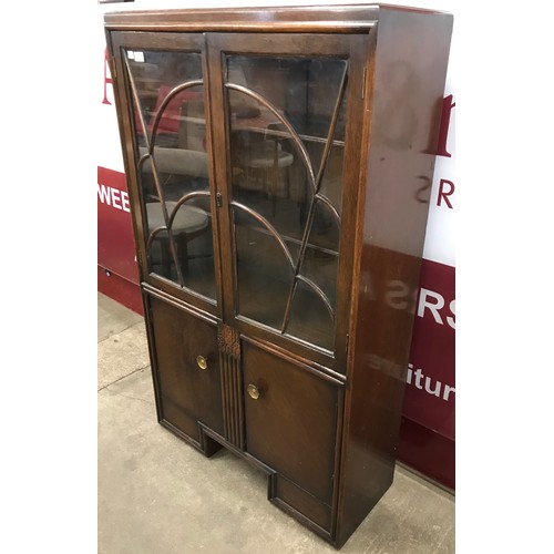 138 - An Art Deco oak four door bookcase