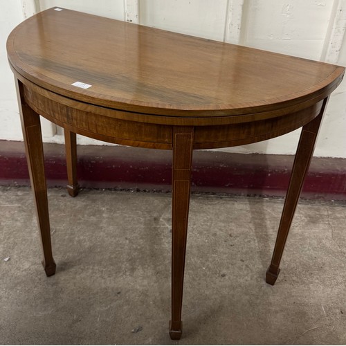 191 - An Edward VII inlaid mahogany demi-lune fold over games table