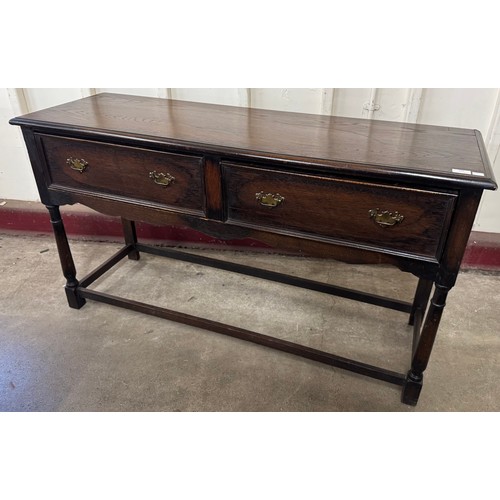 192 - A George III style oak two drawer dresser