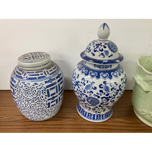 304 - Three blue and white ceramic vases and a jardiniere