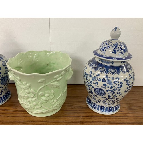 304 - Three blue and white ceramic vases and a jardiniere