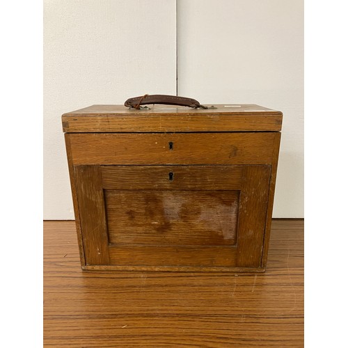 306 - An early 20th Century oak engineers chest, containing thread and other sewing related items