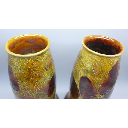 2001 - A pair of Royal Doulton stoneware vases, decorated with leaves, 20cm