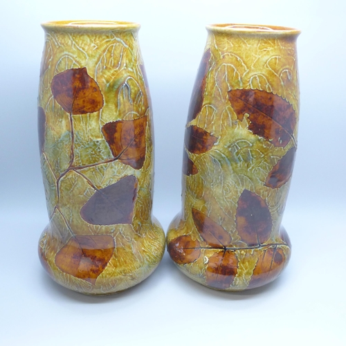 2001 - A pair of Royal Doulton stoneware vases, decorated with leaves, 20cm