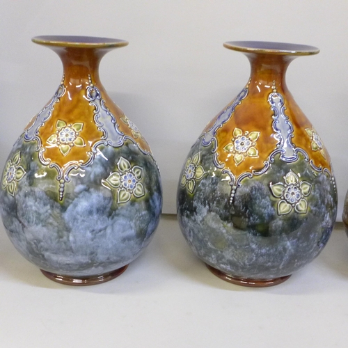 2004 - A pair of Royal Doulton Art Nouveau stoneware vases, 23cm, one a/f, badly cracked, and two other sto... 