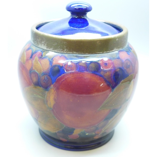 2006 - A Moorcroft pomegranate caddy, impressed mark M122 Y, painted signature, a/f, large crack, 14.5cm