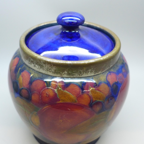 2006 - A Moorcroft pomegranate caddy, impressed mark M122 Y, painted signature, a/f, large crack, 14.5cm