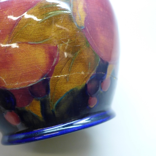 2006 - A Moorcroft pomegranate caddy, impressed mark M122 Y, painted signature, a/f, large crack, 14.5cm