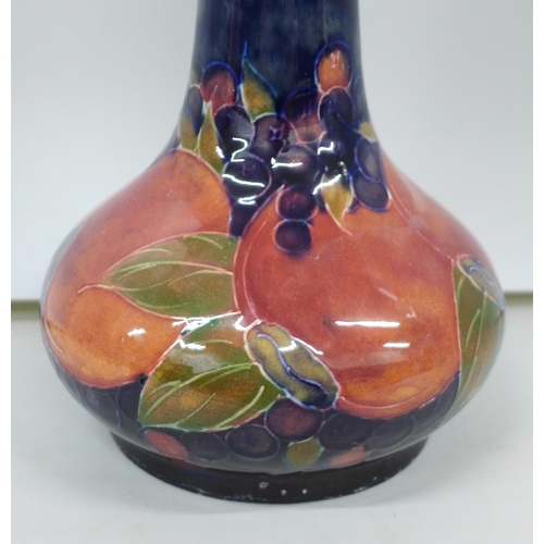 2007 - A Moorcroft pomegranate tall neck vase, painted signature to the base, 32cm, very small chip on the ... 