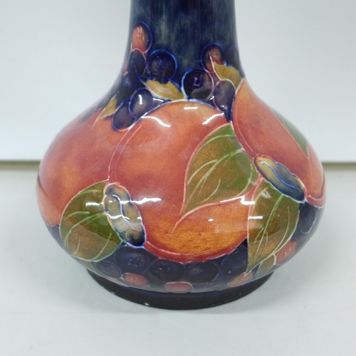 2007 - A Moorcroft pomegranate tall neck vase, painted signature to the base, 32cm, very small chip on the ... 