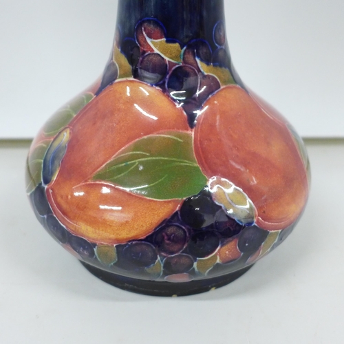 2007 - A Moorcroft pomegranate tall neck vase, painted signature to the base, 32cm, very small chip on the ... 