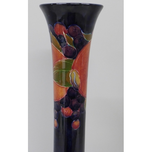 2007 - A Moorcroft pomegranate tall neck vase, painted signature to the base, 32cm, very small chip on the ... 