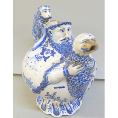 2011 - An 18th Century Dutch Delft jug with monkey handle, a/f, spout chipped