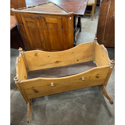 216 - A Victorian walnut corner cupboard and a pine cot