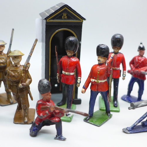 2033 - A collection of mainly Britains model soldiers, a sentry box and two del Prado figures, 24 pieces in... 