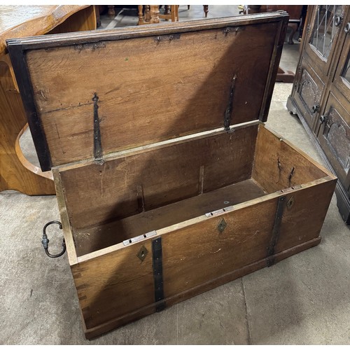 219 - A Victorian teak and burnished steel bound trunk