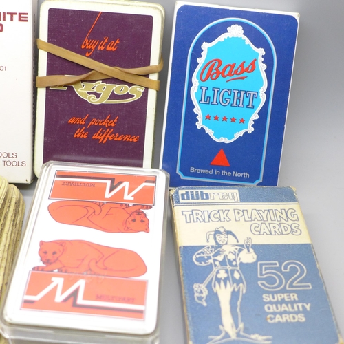 2037 - Fourteen packs of vintage playing cards including advertising