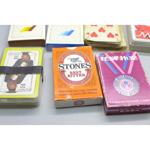 2037 - Fourteen packs of vintage playing cards including advertising