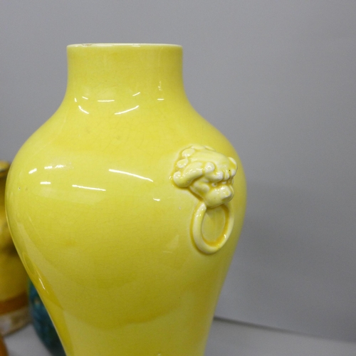 2044 - A Japanese blackware jug, a/f, a similar jug in yellow glaze, yellow and green glaze vases and three... 