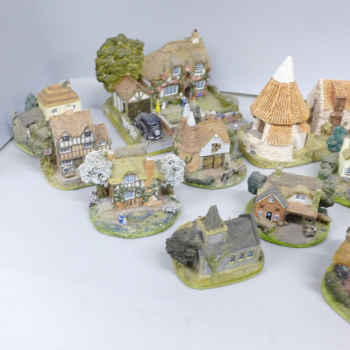 2056 - A collection of twenty-six Danbury Mint cottages