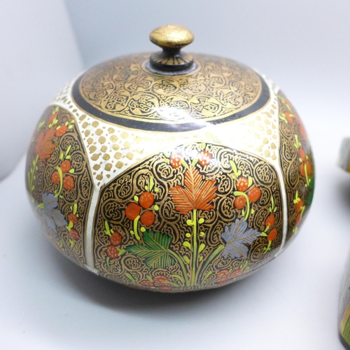 2057 - A pair of papier-mache decorated circular boxes and one other marked hand made in Kashmir