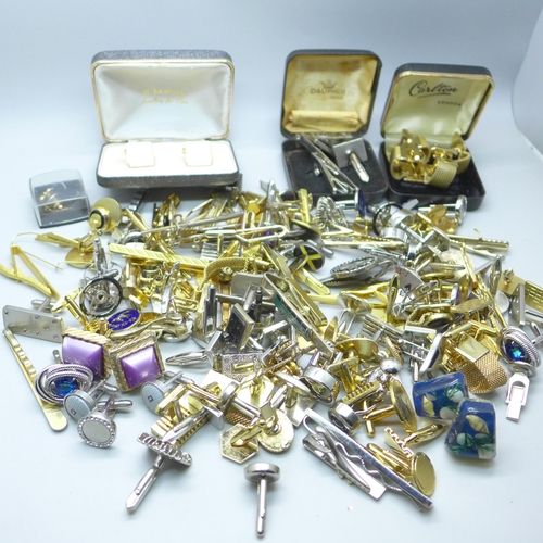 2058 - A large collection of cufflinks and tie-pins